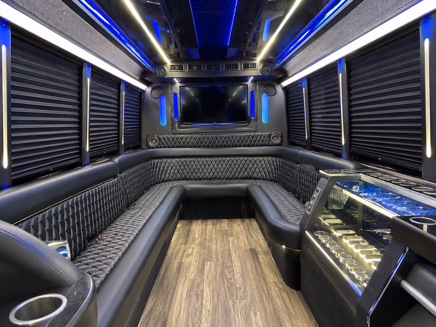 Group beside a Mercedes Sprinter limo in Austin