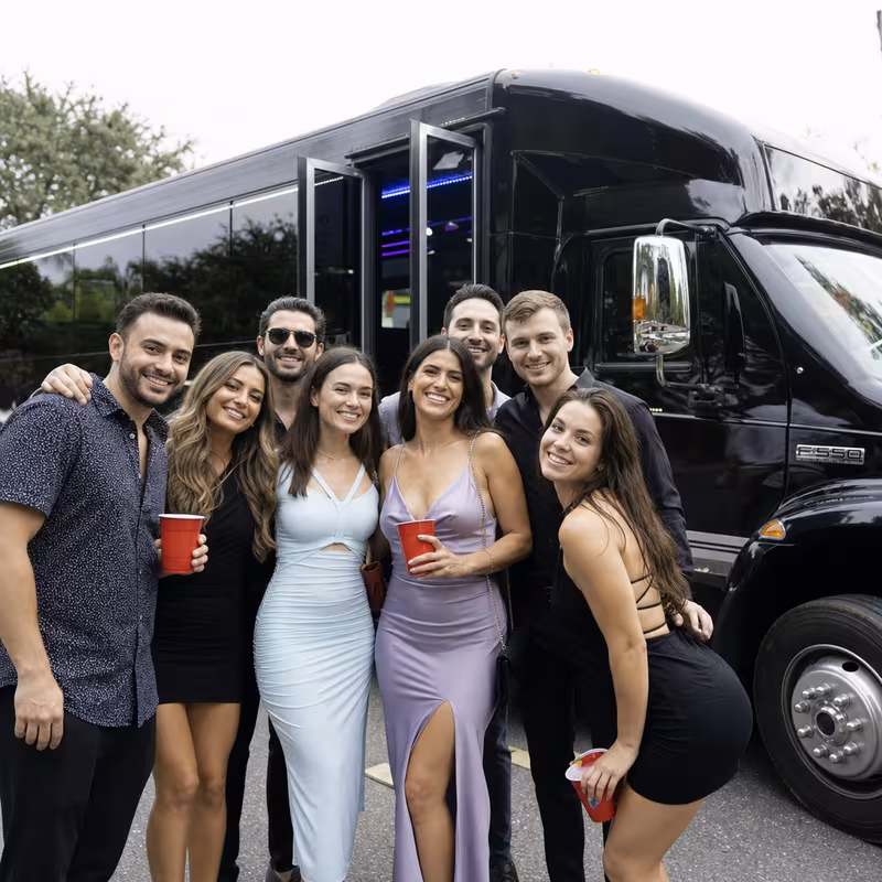 Party bus interior with wraparound leather seating and LED lighting in Austin