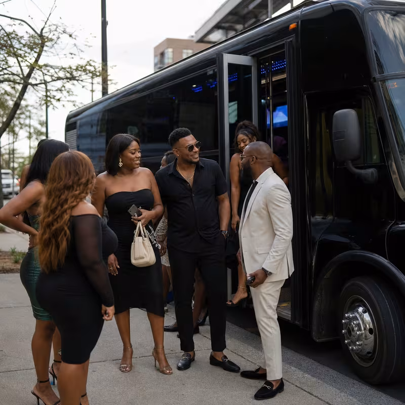 Passengers loading luggage while boarding an Austin group shuttle
