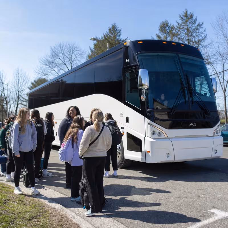 Black Mercedes Sprinter van staged for an Austin School Transportation group