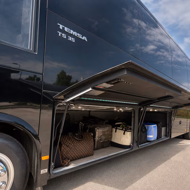 Party bus interior with wraparound leather seating and LED lighting in Austin