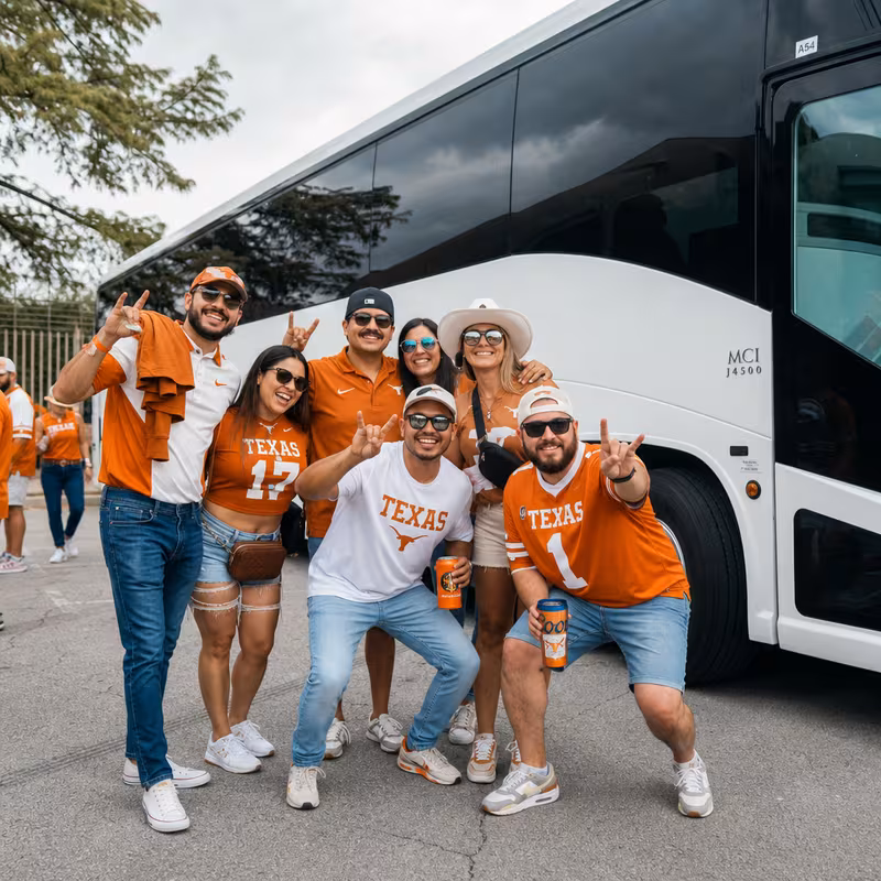 Passengers loading luggage while boarding an Austin group shuttle