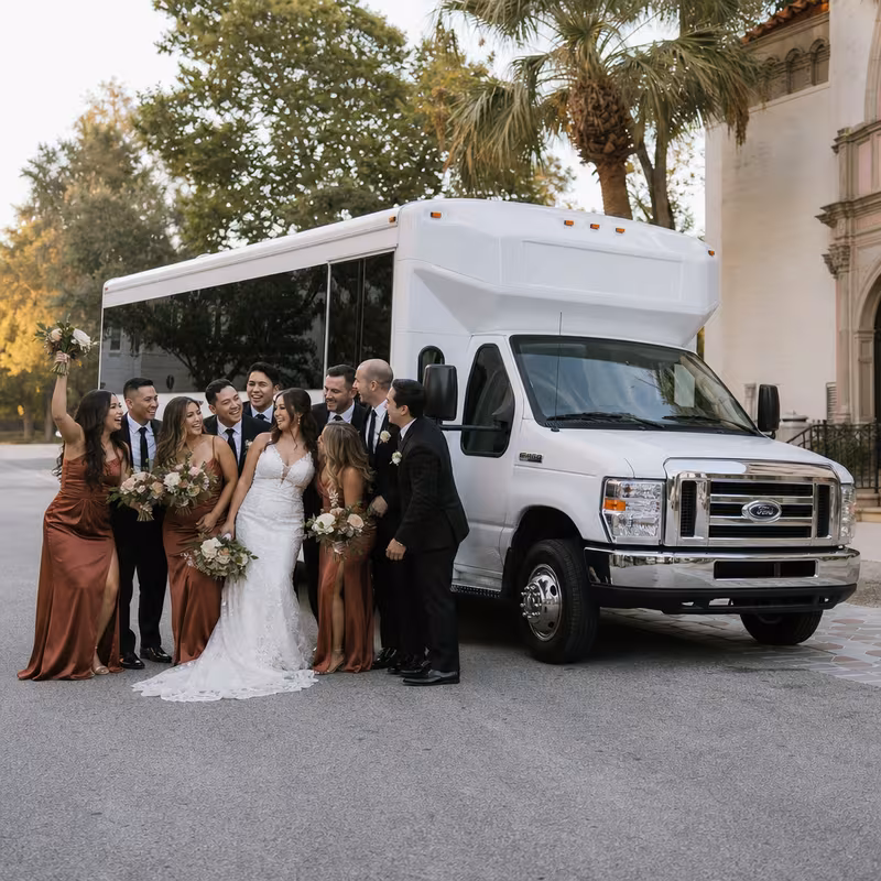 Passengers loading luggage while boarding an Austin group shuttle